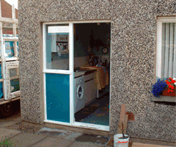 Before & After shots of a rear door and screen in Haddington